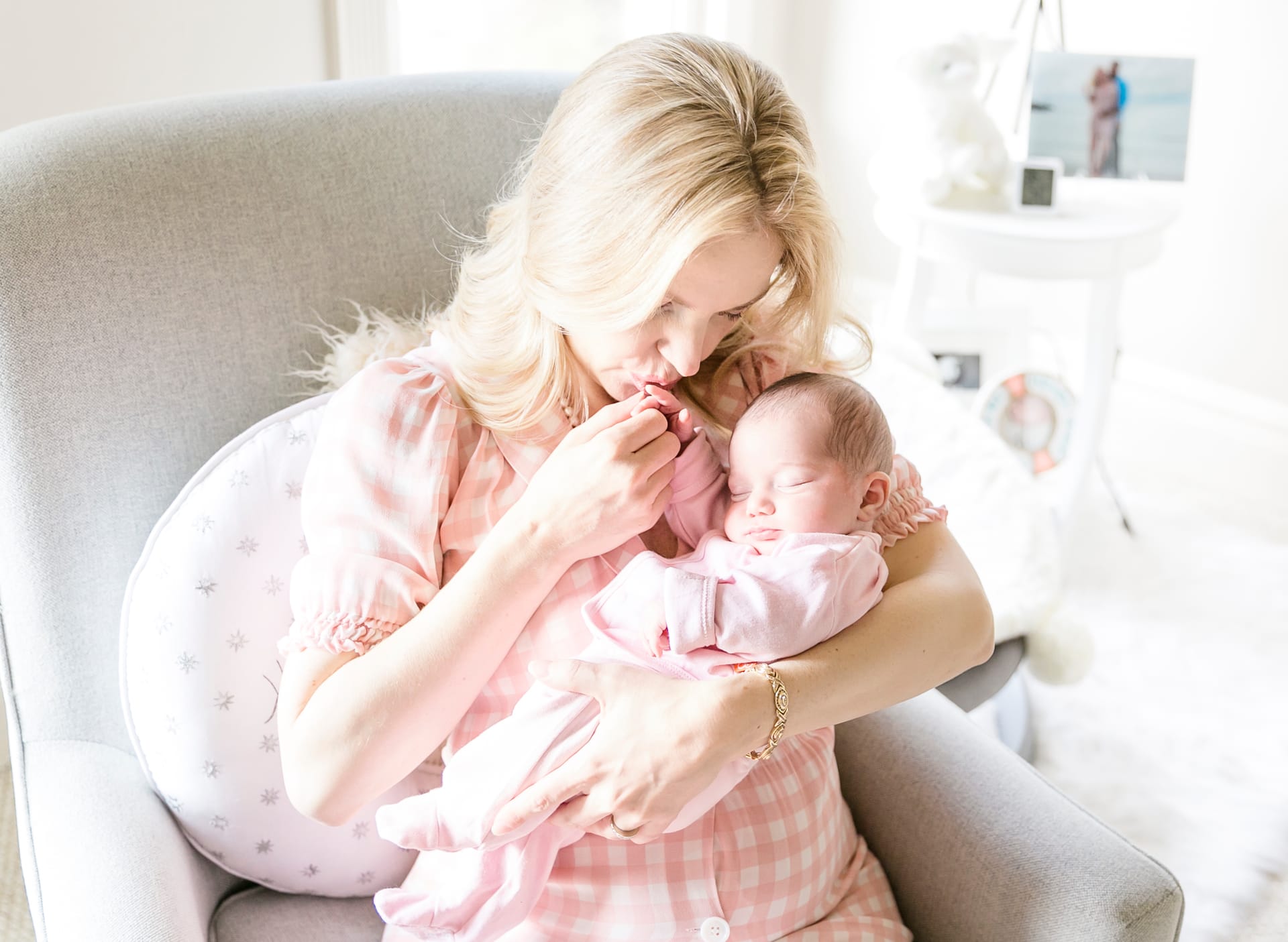 Mother holding her sleeping newborn